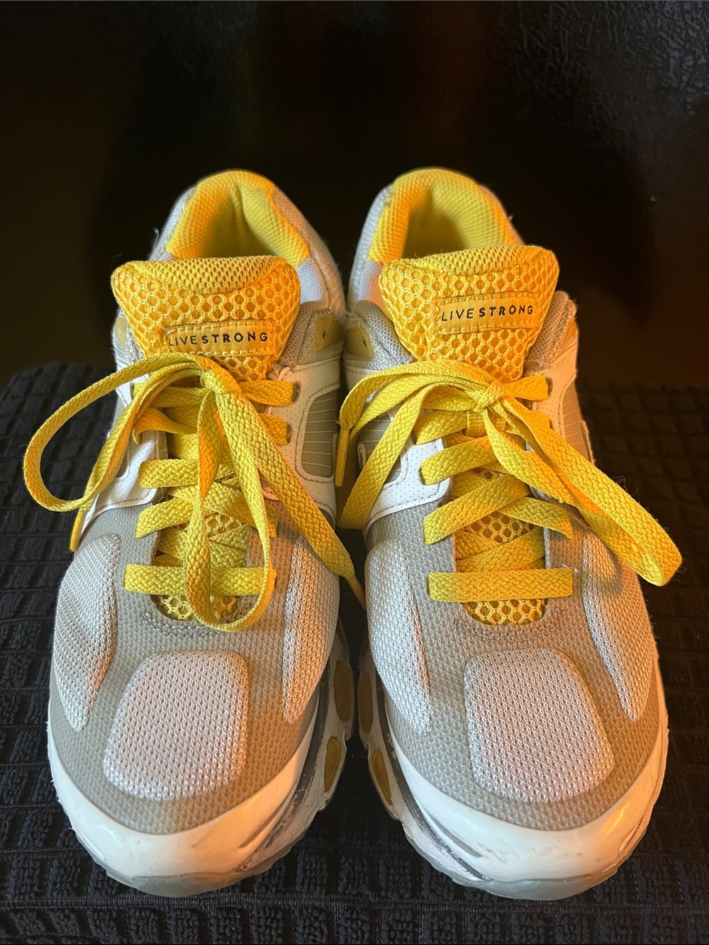 Nike women’s LiveStrong Sneakers in Yellow and White